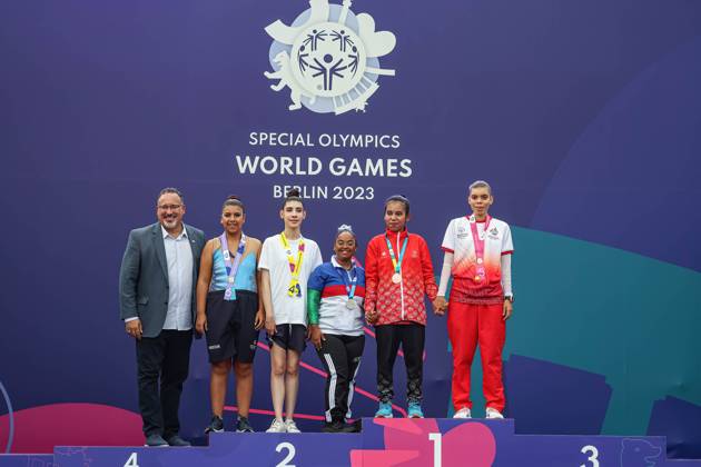 June 18, 2023, Berlin, Germany: Athletes pose with U.S. Secretary of Education, Miguel A. Cardona during Rhythmic gymnastics, Rhythmische Sportgymnastik, RSG award ceremony during the Special Olympics Summer World Games Berlin 2023 in Messe conference centre. The 2023 Berlin Games will host 7000 athletes with learning disabilities from 190 countries. Special Olympics is an international charity which aims to include individuals with learning disabilities into the realm of olympic sports. Berlin 2023 is the biggest sporting as well as charitable event of 2023. Berlin Germany - ZUMAs197 20230618_zaa_s197_156 Copyright: xDominikaxZarzyckax