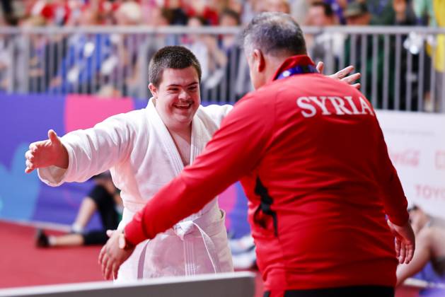 SEPCIAL OLYMPICS WORLD GAMES Special Olympics World Games Berlin 2023 7 Day 23 June 2023 Judo Hamza Dib SYR after winning fight with his coach Berlin Messe Berlin Berlin Germany