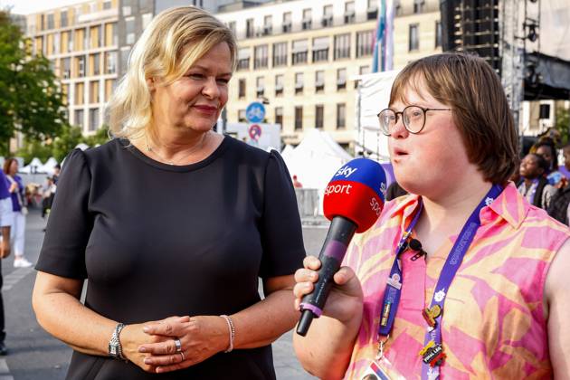 June 22, 2023, Berlin, Germany: Special Olympics volunteer journalist with down syndrome interviews Germany Interior Minister Nancy Faeser for Sky during the street party for athletes and supporters of the Special Olympics. Summer World Games Berlin 2023 in front of the Brandenburg Gate in the center of Berlin. The 2023 Berlin Games hosts 7000 athletes with learning disabilities from nearly 190 countries. Special Olympics is an international charity which aims to include individuals with learning disabilities into the realm of Olympic sports. Berlin 2023 is the biggest sporting and charitable event of 2023. Berlin Germany - ZUMAs197 20230622_zaa_s197_564 Copyright: xDominikaxZarzyckax