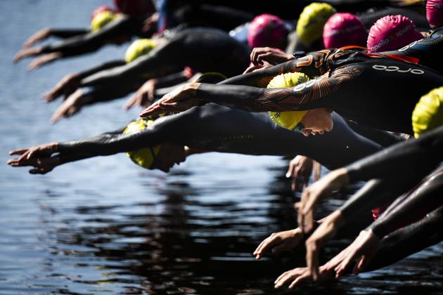 230629 Participants at the start of the swimming part of the triathlon during day 3 of the SM week on June 29, 2023 in Umea.  Copyright: SIMONxELIASSON BB230629SE020