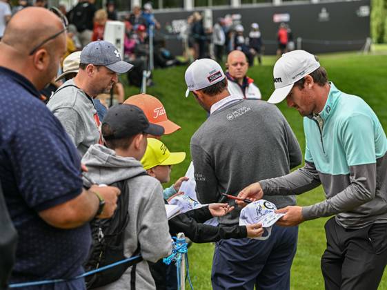 2nd July 2023; The Belfry, Sutton Coldfield, West Midlands, England: Betfred British Masters Golf, Day 4; Andrew Wilson and Edoardo Molinari sign autographs for fans by the 18th green  ActionPlus12526241 GodfreyxPitt