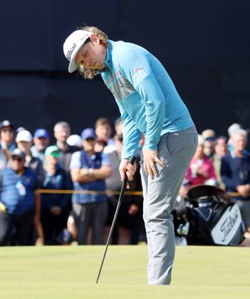 Last year s Open winner Australian Cameron Smith lines up a putt on the second green on the first day at the 151st Open Championship at the Royal Liverpool Golf Club in Hoylake England on Thursday, July 20, 2023.  LON2023072015a HUGOxPHILPOTT