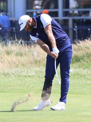 American Dustin Johnson plays a fairway iron on the first day at the 151st Open Championship at Royal Liverpool Golf Club in Hoylake, England on Thursday, July 20, 2023.  LON2023072035 HUGOxPHILPOTT