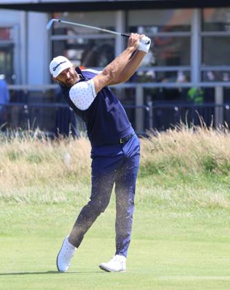 American Dustin Johnson plays a fairway iron on the first day at the 151st Open Championship at Royal Liverpool Golf Club in Hoylake, England on Thursday, July 20, 2023.  LON2023072037d HUGOxPHILPOTT
