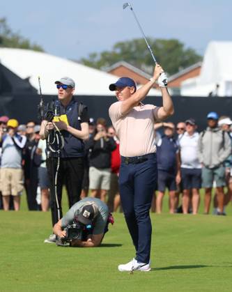 Northern Ireland s Rory Mcllroy hits a fairway iron on the third hole on the first day at the 151st Open Championship at Royal Liverpool Golf Club in Hoylake, England on Thursday, July 20, 2023.  LON20230720108 HUGOxPHILPOTT