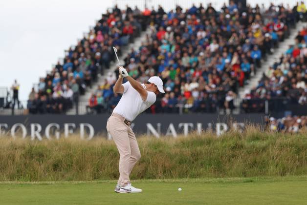 Northern Ireland s Rory Mcllroy plays an iron on the third fairway on the third day at the 151st Open Championship at Royal Liverpool Golf Club in Hoylake, England on Saturday, July 22, 2023.  LON2023072208 HUGOxPHILPOTT