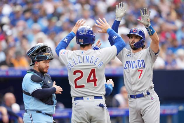 August 12, 2023, Toronto, ON, CANADA: Toronto Blue Jays catcher Alejandro Kirk looks on as Chicago Cubs shortstop Dansby Swanson (7) celebrates after hitting a three run homer with teammate Cody Bellinger (24) during fourth inning MLB, Baseball Herren, USA interleague baseball action against the Toronto Blue Jays, in Toronto, Saturday, Aug. 12, 2023. Chicago Cubs Dansby Swanson; Cody Bellinger; Alejandro Kirk - ZUMAc35_ 20230812_zaf_c35_047 Copyright: xChrisxYoungx