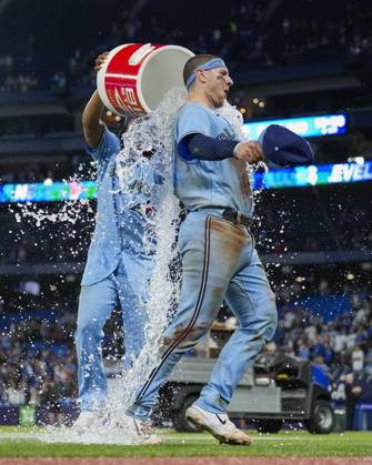 August 28, 2023, TORONTO, ON, CANADA: Toronto Blue Jays catcher Danny Jansen (9) is doused by teammate first baseman Vladimir Guerrero Jr. (27) after defeating the Washington Nationals in MLB, Baseball Herren, USA interleague baseball action in Toronto on Monday, August 28, 2023. Canada News - August 28, 2023 - ZUMAc35_ 20230828_zaf_c35_059 Copyright: xAndrewxLahodynskyjx