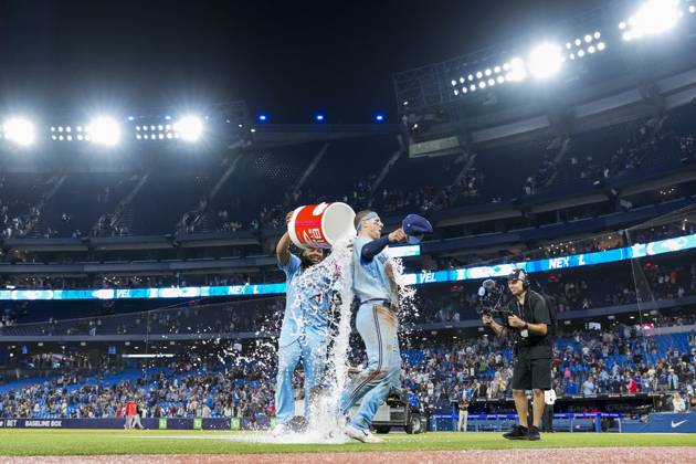 August 28, 2023, TORONTO, ON, CANADA: Toronto Blue Jays catcher Danny Jansen (9) is doused by teammate first baseman Vladimir Guerrero Jr. (27) after defeating the Washington Nationals in MLB, Baseball Herren, USA interleague baseball action in Toronto on Monday, August 28, 2023. Canada News - August 28, 2023 - ZUMAc35_ 20230828_zaf_c35_060 Copyright: xAndrewxLahodynskyjx