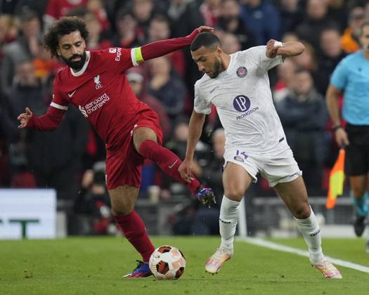 UEFA Europa League Liverpool v Toulouse Mohamed Salah 11 of Liverpool competes for the ball with Yanis Begraoui 14 of Toulouse during the UEFA Europa League match Liverpool vs Toulouse at Anfield, Liverpool, United Kingdom, 26th October 2023 (Photo by Steve Flynn News Images) Liverpool Anfield Merseyside United Kingdom Copyright: xStevexFlynn NewsxImagesx