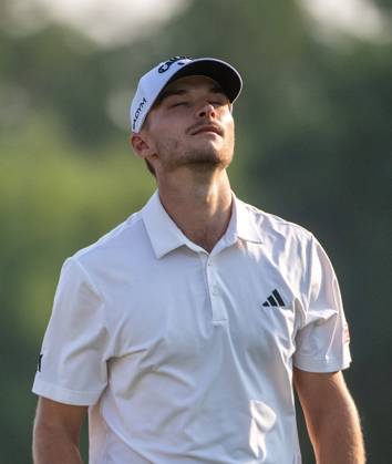 NICOLAI HoJGAARD of Denmark reacts after missing a putt on the 18th green during DP World Tour Championship in Dubai, United Arab Emirates, Nov 19, 2023. Dubai United Arab Emirates  Copyright: xMARTINxDOKOUPILx 443_2108