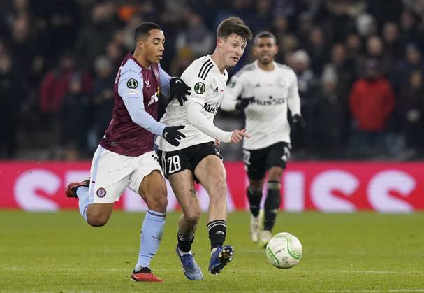Birmingham, England, 30th November 2023. Marc Gual of Legia Warsaw (R) is challenged by Youri Tielemans of Aston Villa during the UEFA Europa Conference League match at Villa Park, Birmingham. Picture credit should read: Andrew Yates Sportimage EDITORIAL USE ONLY. No use with unauthorised audio, video, data, fixture lists, club league logos or live services. Online in-match use limited to 120 images, no video emulation. No use in betting, games or single club league player publications. SPI-2764-0019