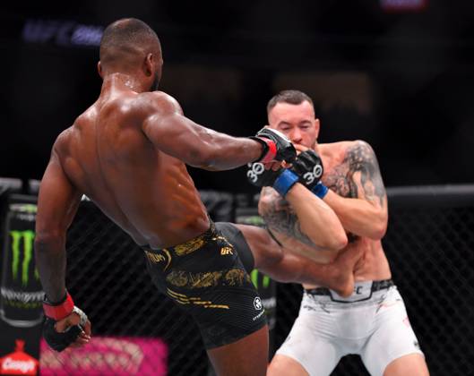 December 16, 2023, Las Vegas, Nevada, USA: LEON EDWARDS (21-3-0) of Erdington, birmingham, England (L) defeats COLBY COVINGTON (17-3-0) of Miami, Florida USA (R) by a unanimous decision (49-46, 49-46, 49-46) during UFC 296 at T-Mobile Arena, Las Vegas Las Vegas USA - ZUMAo117 20231216_zsp_o117_044 Copyright: xMikaelxOnax