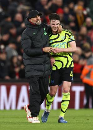 Liverpool, England, 23rd December 2023. Jurgen Klopp manager of Liverpool hugs Declan Rice of Arsenal during the Premier League match at Anfield, Liverpool. Picture credit should read: Darren Staples Sportimage EDITORIAL USE ONLY. No use with unauthorised audio, video, data, fixture lists, club league logos or live services. Online in-match use limited to 120 images, no video emulation. No use in betting, games or single club league player publications. SPI-2829-0072