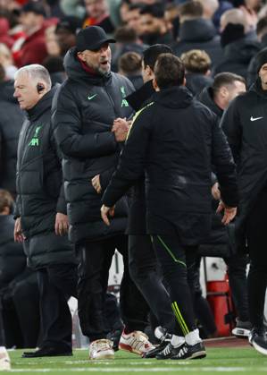 Liverpool, England, 23rd December 2023. Jurgen Klopp manager of Liverpool shakes hands with Mikel Arteta manager of Arsenal (hidden) during the Premier League match at Anfield, Liverpool. Picture credit should read: Darren Staples Sportimage EDITORIAL USE ONLY. No use with unauthorised audio, video, data, fixture lists, club league logos or live services. Online in-match use limited to 120 images, no video emulation. No use in betting, games or single club league player publications. SPI-2829-0073