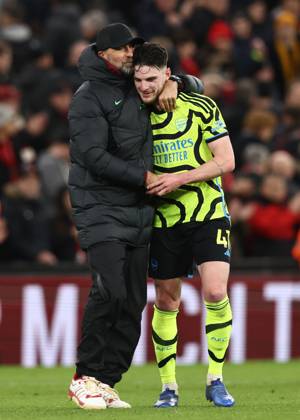Liverpool, England, 23rd December 2023. Jurgen Klopp manager of Liverpool hugs Declan Rice of Arsenal during the Premier League match at Anfield, Liverpool. Picture credit should read: Darren Staples Sportimage EDITORIAL USE ONLY. No use with unauthorised audio, video, data, fixture lists, club league logos or live services. Online in-match use limited to 120 images, no video emulation. No use in betting, games or single club league player publications. SPI-2829-0074