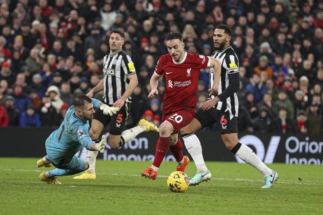 Football - 2023 2024 Premier League - Liverpool vs Newcastle United - Anfield - Monday 1st January 2024. Diogo Jota of Liverpool is brought down by Martin Dubravka of Newcastle United for a penalty