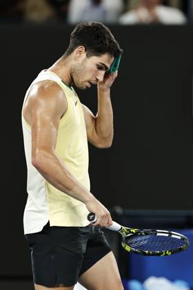 Tennis: Australian Open Carlos Alcaraz of Spain wipes his brow after losing to Alexander Zverev of Germany in the men s singles quarterfinals at the Australian Open tennis tournament in Melbourne in the small hours of Jan. 25, 2024. A14AA0002376798P