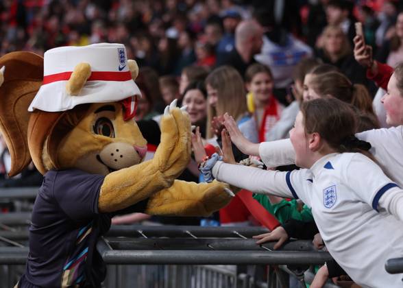 London, England, 5th April 2024. The England team mascots give high fives to fans during the UEFA Women s European Qualifier match at Wembley Stadium, London. Picture: Paul Terry Sportimage EDITORIAL USE ONLY. No use with unauthorised audio, video, data, fixture lists, club league logos or live services. Online in-match use limited to 120 images, no video emulation. No use in betting, games or single club league player publications. SPI-3058-0041