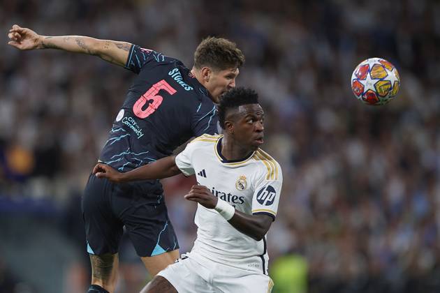 2024-04-09 Real Madrid CF v Manchester City - Quarter-final First Leg - UEFA Champions League 2023 24 MADRID, SPAIN - APRIL 9: Vinicius Junior of Real Madrid CF competes for the ball with John Stones of Manchester City during the Quarter-final First Leg - UEFA Champions League match between Real Madrid CF and Manchester City at Estadio Santiago Bernabeu on April 9, 2024 in Madrid, Spain. (Photo by Pablo Morano BSR Agency) Madrid Spain Content not available for redistribution in The Netherlands directly or indirectly through any third parties. Copyright: xBSRxAgencyx