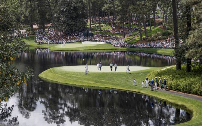 Golfers walk off the eighth green during the Par 3 contest at the Masters Tournament at Augusta National Golf Club in Augusta, Georgia on Wednesday, April 10, 2024.  AUG20240410549 TANNENxMAURY