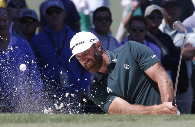 Dustin Johnson hits out of a bunker on the seventh hole in the second round of the Masters Tournament at Augusta National Golf Club in Augusta, Georgia on Friday, April 12, 2024.  AUG20240412539 TANNENxMAURY
