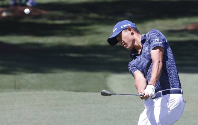 Collin Morikawa chips to the green on the seventh hole in the second round of the Masters Tournament at Augusta National Golf Club in Augusta, Georgia on Friday, April 12, 2024.  AUG20240412540 TANNENxMAURY