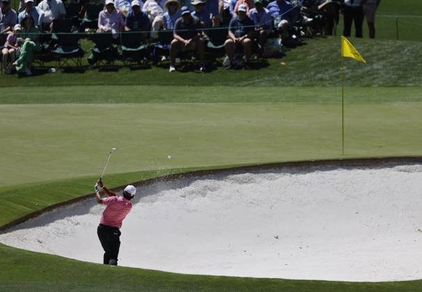 Japan s Hideki Matsuyama plays out of a bunker on the fourth hole in the second round of the Masters Tournament at Augusta National Golf Club in Augusta, Georgia on Friday, April 12, 2024.  AUG202404125674 TANNENxMAURY