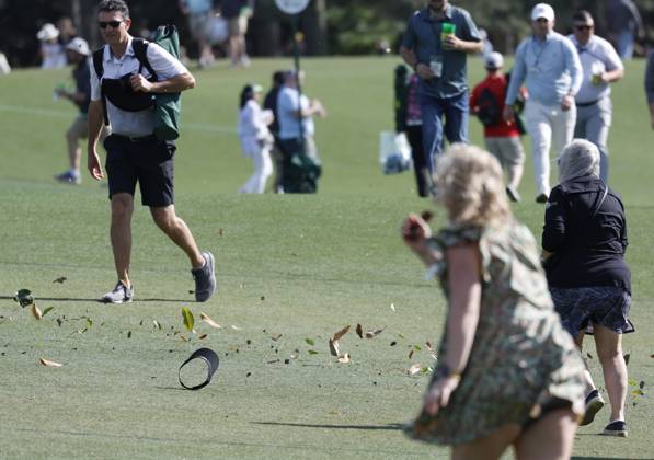 Strong winds blow debris across the course during the second round of the Masters Tournament at Augusta National Golf Club in Augusta, Georgia on Friday, April 12, 2024.  AUG20240412148 JOHNxANGELILLO