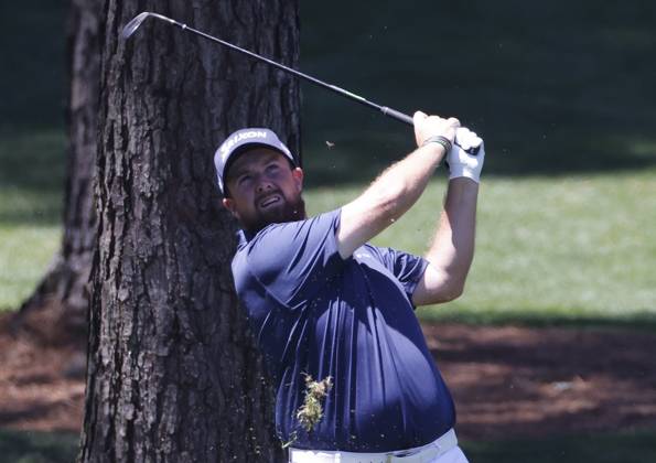 Ireland s Shane Lowry hits an approach shot on the seventh hole during the third round of the Masters Tournament at Augusta National Golf Club in Augusta, Georgia on Saturday, April 13, 2024.  AUG20240413505 TANNENxMAURY