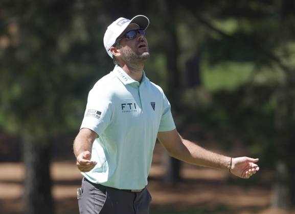 Canada s Corey Conners reacts after missing a putt on the seventh hole during the third round of the Masters Tournament at Augusta National Golf Club in Augusta, Georgia on Saturday, April 13, 2024.  AUG20240413506 TANNENxMAURY