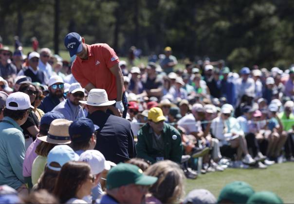 Denmark s Nicolai Hojgaard hits out of the crowd on the second hole during the third round of the Masters Tournament at Augusta National Golf Club in Augusta, Georgia on Saturday, April 13, 2024.  AUG20240413520 TANNENxMAURY