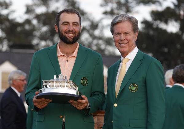 Masters winner Scottie Scheffler (L) stands with Masters chairman Fred Ridley after the final round of the Masters tournament at Augusta National Golf Club in Augusta, Georgia on Sunday, April 14, 2024. Scheffler won with a score of 11 under par.  AUG20240414581 TANNENxMAURY