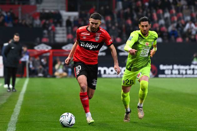 Mehdi MERGHEM ( 10 - Guingamp ) and Florent HANIN ( 26 - Angers ) during the Ligue 2 match between EA Guingamp and Angers SCO at Stade Municipal de Roudourou on April 23, 2024 in Guingamp, France. ( Photo by federico pestellini panoramic ) - FOOTBALL : Guingamp vs Angers - Ligue 2 - 23 04 2024 FedericoPestellini Panoramic