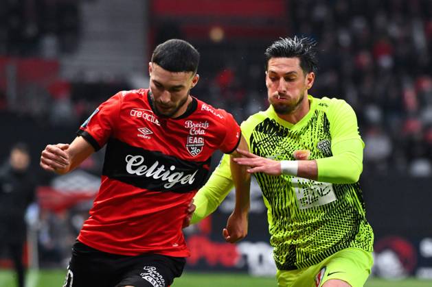 Mehdi MERGHEM ( 10 - Guingamp ) and Florent HANIN ( 26 - Angers ) during the Ligue 2 match between EA Guingamp and Angers SCO at Stade Municipal de Roudourou on April 23, 2024 in Guingamp, France. ( Photo by federico pestellini panoramic ) - FOOTBALL : Guingamp vs Angers - Ligue 2 - 23 04 2024 FedericoPestellini Panoramic