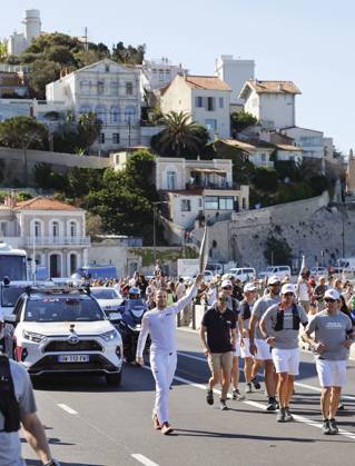 Paris Olympic torch relay begins A torchbearer runs in Marseille on May 9, 2024, as the Paris Olympic torch relay begins following the arrival of the Olympic flame in the southern French port city on a majestic three-mast ship. About 10,000 torchbearers are to pass through over 400 towns until the games opening ceremony in Paris on July 26.  A14AA0002809051P