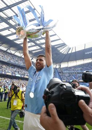 Manchester, England, 19th May 2024. Rodri of Manchester City celebrates with the Premier league trophy during the Premier League match at the Etihad Stadium, Manchester. Picture credit should read: Andrew Yates Sportimage EDITORIAL USE ONLY. No use with unauthorised audio, video, data, fixture lists, club league logos or live services. Online in-match use limited to 120 images, no video emulation. No use in betting, games or single club league player publications. SPI-3159-0067