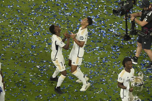Vinicius Jr (Real Madrid CF) and Jude Bellingham (Real Madrid CF) dancing during the Trophy parade, Real Madrid trophy parade, Real Madrid Trophy parade, Cibeles, June 3, 2024, Madrid, Spain.