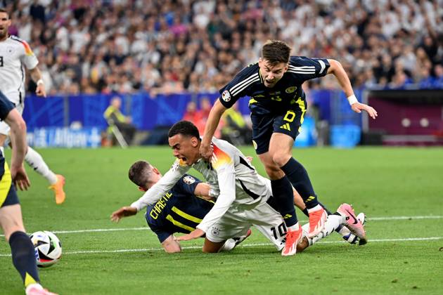 14 06 2024, xjrdrx, Football EM 2024, Germany Scotland emspor, v l Ryan Christie Team Scotland Jamal Musiala Deutsche Fussball Nationalmannschaft DFB Kieran Tierney Team Scotland Zweikampf, Aktion, action, battle for the ball DFL DFB REGULATIONS PROHIBIT ANY USE OF PHOTOGRAPHS as IMAGE SEQUENCES and or QUASI VIDEO Munich