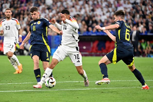 14 06 2024, xjrdrx, Football EM 2024, Germany Scotland emspor, v l Ryan Christie Team Scotland Jamal Musiala Deutsche Fussball Nationalmannschaft DFB Kieran Tierney Team Scotland Zweikampf, Aktion, action, battle for the ball DFL DFB REGULATIONS PROHIBIT ANY USE OF PHOTOGRAPHS as IMAGE SEQUENCES and or QUASI VIDEO Munich