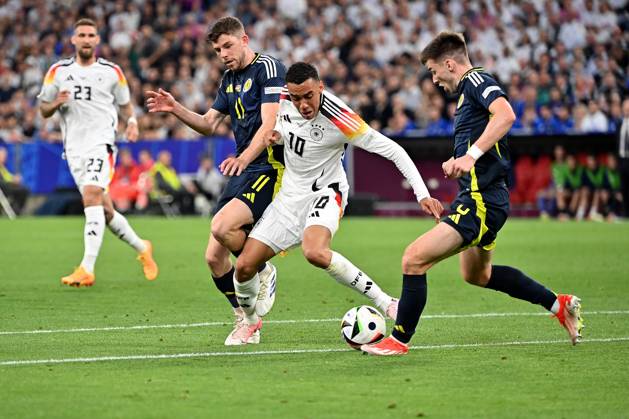 14 06 2024, xjrdrx, Football EM 2024, Germany Scotland emspor, v l Ryan Christie Team Scotland Jamal Musiala Deutsche Fussball Nationalmannschaft DFB Kieran Tierney Team Scotland Zweikampf, Aktion, action, battle for the ball DFL DFB REGULATIONS PROHIBIT ANY USE OF PHOTOGRAPHS as IMAGE SEQUENCES and or QUASI VIDEO Munich