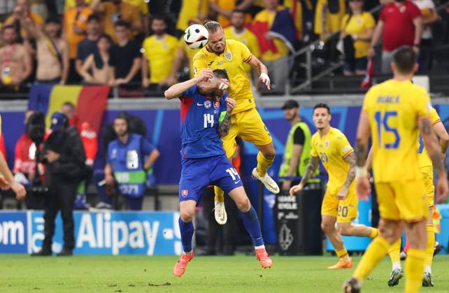26 06 2024, European Football Championship, UEFA EURO 2024, Slovakia Romania, Group E, Arena Frankfurt, f l , Milan Skriniar Slovakia , George Alexandru Puscas Romania Copyright: HMBxMedia