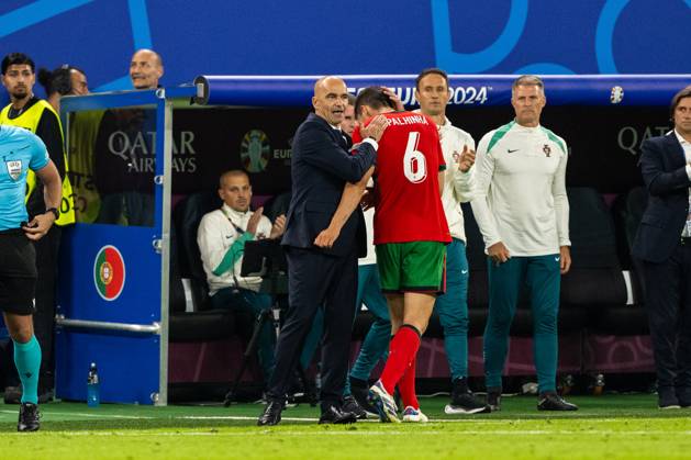 Portugal v France, UEFA EURO, EM, Europameisterschaft,Fussball 2024, Hamburg, Germany Hamburg, Germany. 05th, July 2024. Head coach Roberto Martinez of Portugal seen with Joao Palhinha (6) during the UEFA Euro 2024 quarter final match between Portugal and France at Volksparkstadion in Hamburg. Hamburg Germany Copyright: xGonzalesxPhoto FrederikkexJensenx