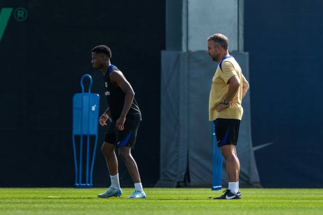(240720) -- BARCELONA, July 20, 2024 -- FC Barcelona, Barca s head coach Hansi Flick and player Ansu Fati (L) attend a training session at the Joan Gamper training ground, near Barcelona, Spain, on July 19, 2024. (Photo by Xinhua) (SP)SPAIN-BARCELONA-FOOTBALL-TRAINING SESSION Joanxgosa