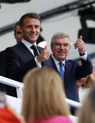(240726) -- PARIS, July 26, 2024 -- International Olympic Committee (IOC) President Thomas Bach (R) and French President Emmanuel Macron are seen during the opening ceremony of the Paris 2024 Olympic Games, Olympische Spiele, Olympia, OS in Paris, France, July 26, 2024. ) (PARIS2024) FRANCE-PARIS-OLY-OPENING CEREMONY GaoxJing