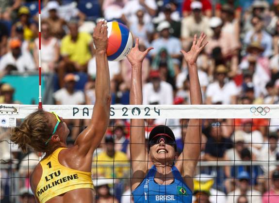 RUSSIA, PARIS - JULY 30, 2024: Brazil s Carolina Solberg Salgado (R) and Lithuania s Monika Paulikene play a womenâ€™s Pool E Beach volleyball, Beachvolleyball match during the 2024 Summer Olympics at the Eiffel Tower Stadium on the Champ de Mars. Alexander Shcherbak TASS  72546292