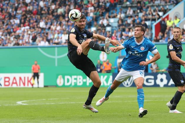 18 08 2024, xtgx, Football DFB Cup 1 round, FC Hansa Rostock Hertha BSC Berlin emspor, v l Linus Gechter Hertha, 44 , Alexander Rossipal Rostock, 21 duel, duel, fight, tackle DFL DFB REGULATIONS PROHIBIT ANY USE OF PHOTOGRAPHS as IMAGE SEQUENCES and or QUASI VIDEO Rostock