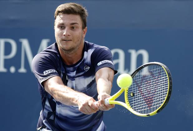 Miomir Kecmanovic of Serbia returns a ball to Yoshihito Nishioka of Japan in the first round of the 2024 US Open Tennis Championships in at the USTA Billie Jean King National Tennis Center on Saturday, August 26, 2024 in New York City.  NYP20240826108 JOHNxANGELILLO