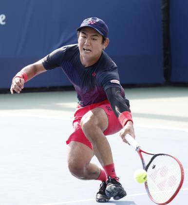 Yoshihito Nishioka of Japan reaches to return a ball to Miomir Kecmanovic of Serbia in the first round of the 2024 US Open Tennis Championships in at the USTA Billie Jean King National Tennis Center on Saturday, August 26, 2024 in New York City.  NYP20240826110 JOHNxANGELILLO