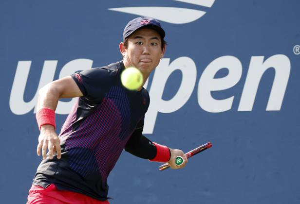 Yoshihito Nishioka of Japan returns a ball to Miomir Kecmanovic of Serbia in the first round of the 2024 US Open Tennis Championships in at the USTA Billie Jean King National Tennis Center on Saturday, August 26, 2024 in New York City.  NYP20240826111 JOHNxANGELILLO
